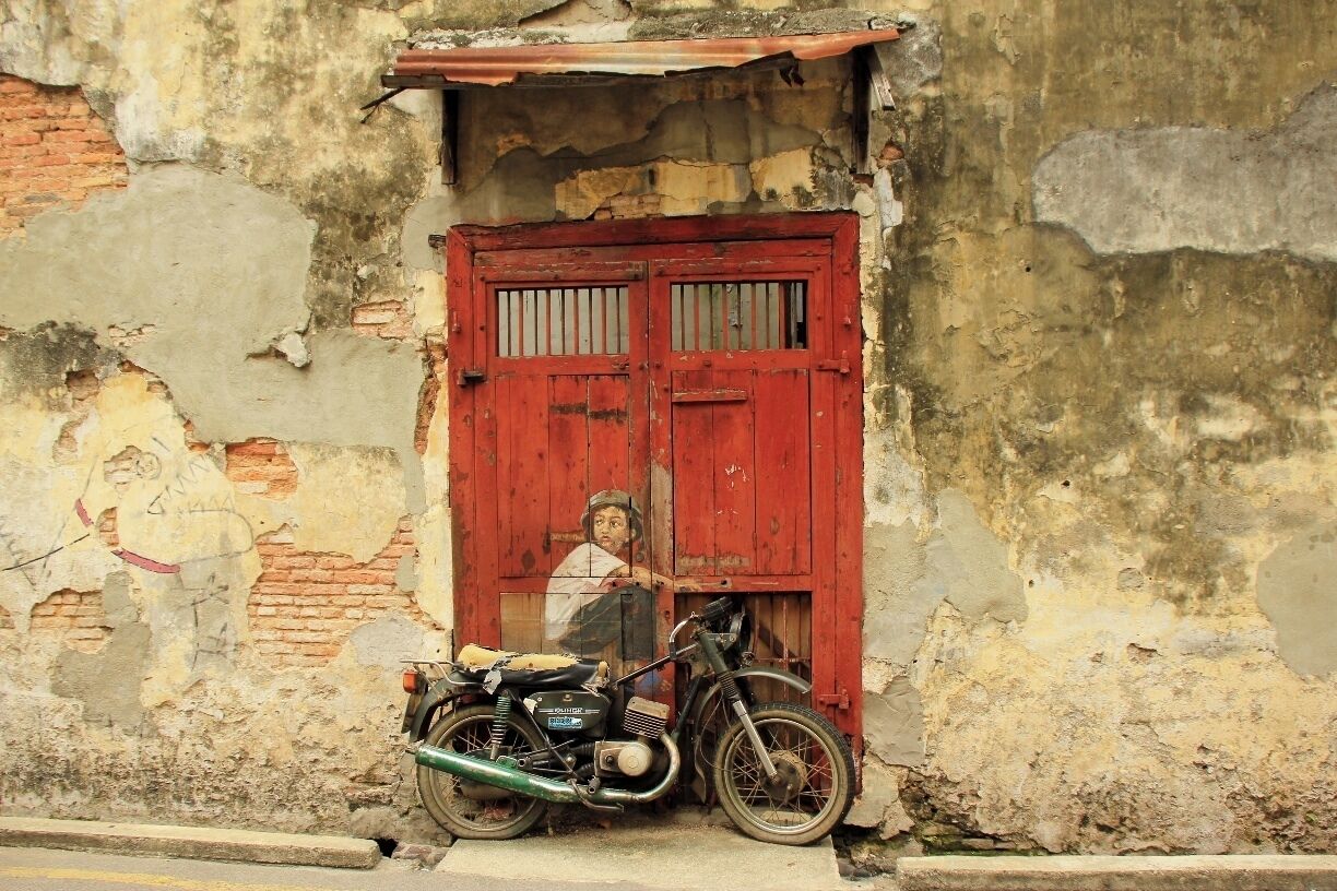 Penang is a great town filled with fun cafe's, good food, and incredible street art.

Spend the day roaming around Little Armenia and Little India to discover all the wonderful hidden gems by Penang's local artists. 

Yes, that is a real motorcycle installation. 

"Lithuanian artist Ernest Zacharevic is leaving his mark with beautiful wall painting of children all across historical Georgetown. The artworks are funny, fascinating, and very much open to everyone’s interpretations." --http://www.onlypenang.com