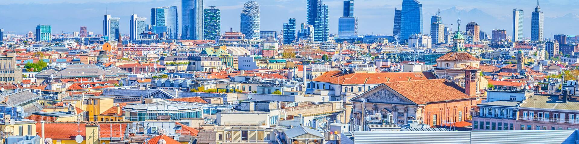 The roofs ofhistoric buildings and the Milan Financial District in the background, Italy.