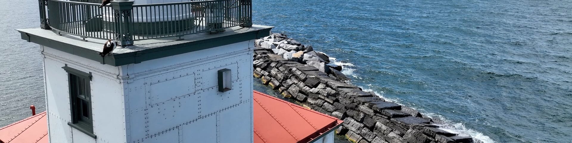 Lighthouse in Oswego New York close up on Lake Ontario at the mouth of Oswego River and harbor in small town on the coast of the Great Lake Historic Architecture Harbor beacon for boaters
