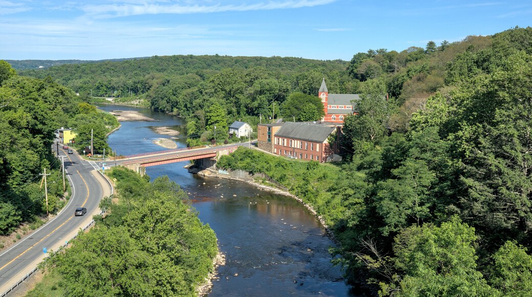 view of a bridge over the rondout creek and a small church in rosendale new york (seen from the wallkill valley rail trail) trestle crossing high falls new paltz