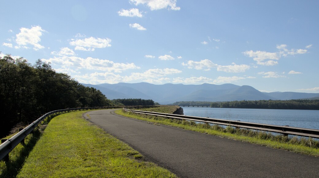 ashokan reservoir promenade surface next to large pond body of water and catskills mountains in the background (public park leisure, walking biking path trail) sunny day travel hudson valley new york
