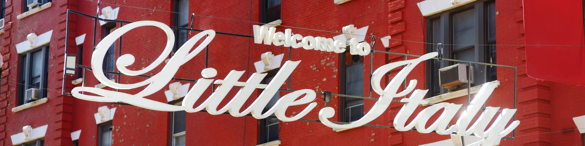 'Welcome to Little Italy' sign in Italian community named Little Italy in downtown Manhattan, New York City.
