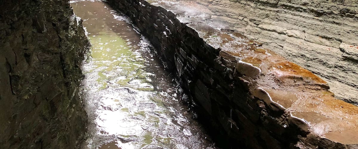 Stream, waterfalls, cliffs and rocks. Hiking trail at Watkins Glen State Park, Upstate New York, south of Seneca Lake in Finger Lake Region