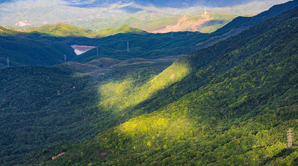 Wind turbines after a summer rain on Queya Mountain, Dongyuan County, Heyuan, Guangdong, China.