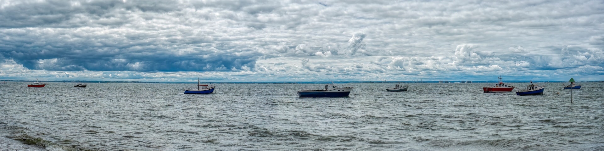 UK, Clacton 30 June 2023, Clacton-on-Sea, row of fishing oats in the ocean