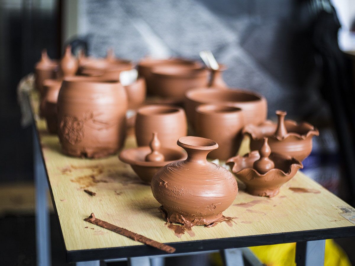 Clay pots on a wooden table.