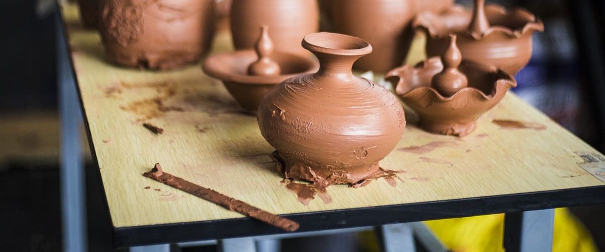 Clay pots on a wooden table.