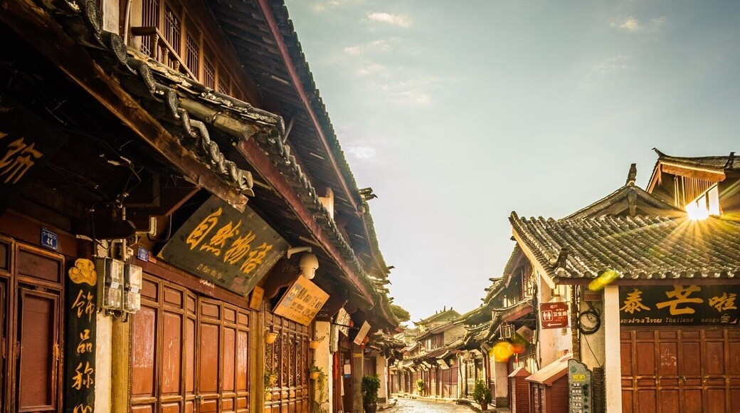If you get up early enough, you can walk through the old ancient town of Lijiang before anyone opens a shop or steps out into the old cobbles. A true way to see this area and a great time for photos as the golden sun hits the reflecting stones.