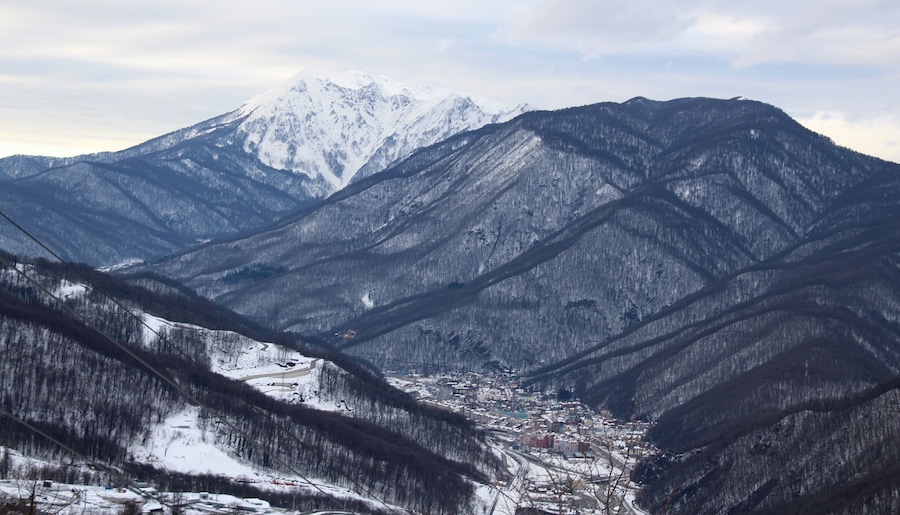 Rosa Khutor, located in Russia's Western Caucasus. This was my favorite viewpoint from that day trip into the mountains. I was based in Adler, a district of Sochi, which has great mountain views of it's own (despite not actually being in the mountains itself). What made Adler so great was it's mild winter climate and seaside location but also having those mountain views and being under 1 hour away from into the mountains itself. During winter time less than 1 hour is the difference between two totally different worlds. And more about the location of this photo: Rosa Khutor is located in Krasnaya Polyana, in the Adler region of the city of Sochi. Don't let that fool you, though: Sochi city is, geographically, really huge. There's many different parts of it, including the rural mountains. Additionally, this area is part of Krasnodar Krai, one of Russia's federal subjects. And Rosa Khutor, as an alpine ski resort, is quite new. Constructed from 2003 to 2011, it hosted the alpine skiing events for the 2014 Winter Olympics and Paralympics. I'll definitely be returning here someday and seeing how it looks in different seasons!