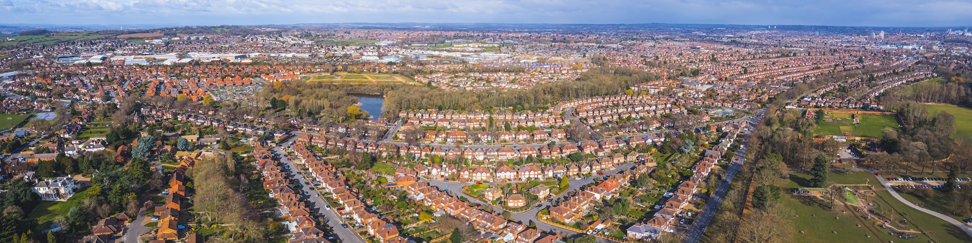 magnificent aerial panorama of the Wollaton suburb in Nottingham, green fields and houses in a row. High quality photo