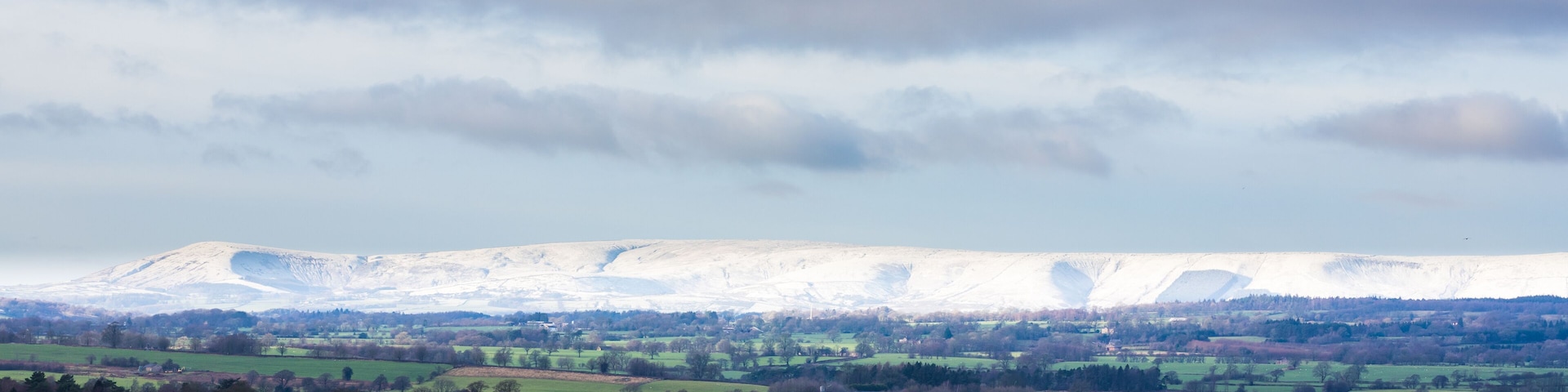 Snowy mountain covered in fresh winter snow. Panoram of snowy hills in the ribble valley, lancashire
