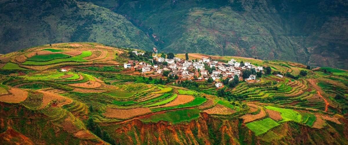 Travel up into the mountains of Dongchuan and look down onto the colourful fields below.  The scale here is tremendous as you realise the size of the mountains, villages and fields below you.  The colours are different all year as they plant different crops and harvest them. This is truly Gods Palette and it’s clear to see why they call it that when you are here.  #GreatOutdoors