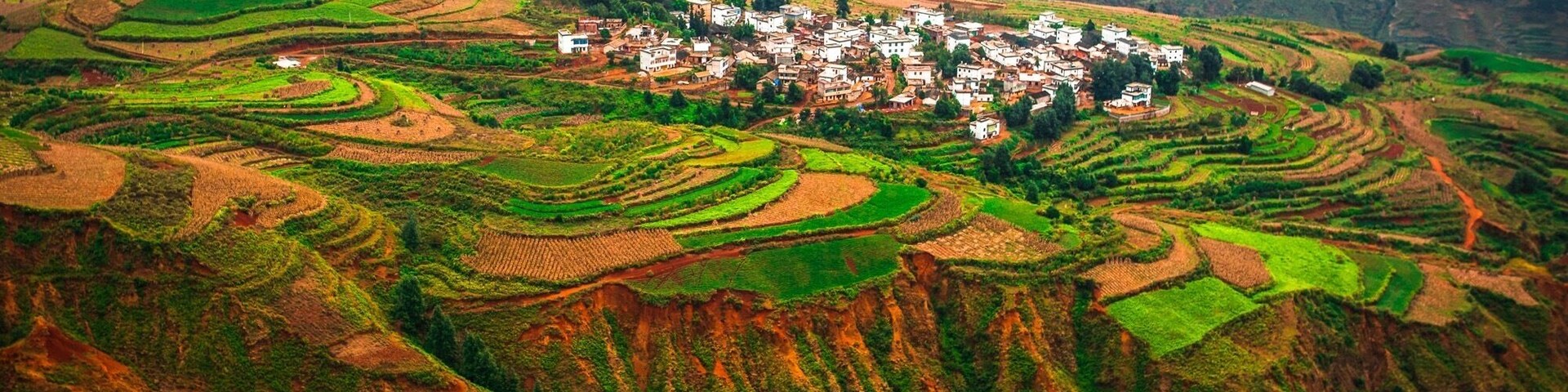 Travel up into the mountains of Dongchuan and look down onto the colourful fields below.  The scale here is tremendous as you realise the size of the mountains, villages and fields below you.  The colours are different all year as they plant different crops and harvest them. This is truly Gods Palette and it’s clear to see why they call it that when you are here.  #GreatOutdoors