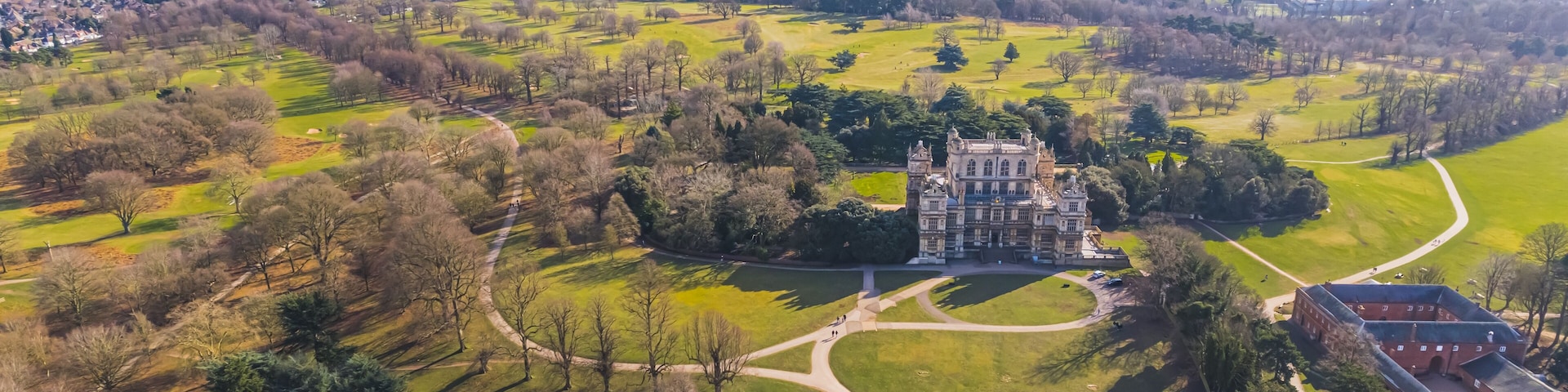 magnificent scenic shot of Wollaton Hall on a sunny day, Natural History Museum, Nottingham, England. High quality photo