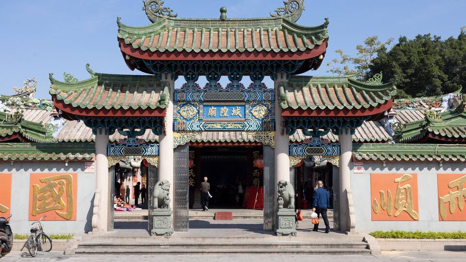People pray for the New Year at the Chenghuang Temple in Jieyang, Guangdong, China