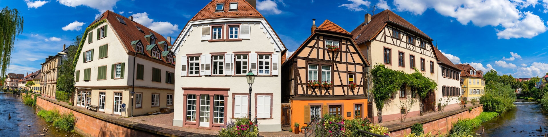 Old city of Ettlingen in Germany with a river and a church. View of a central district of Ettlingen, Germany, with a river and a bell tower of a church. Ettlingen, Baden Wurttemberg, Germany.