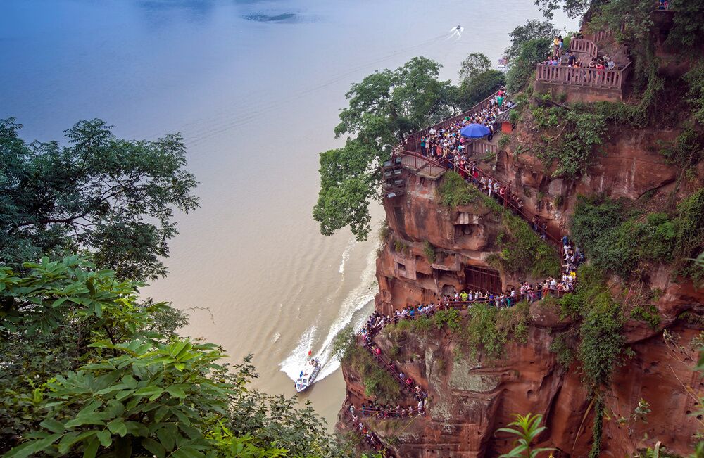 The Leshan Giant Buddha is a 71-metre (233 ft) tall stone statue, built during the Tang Dynasty.It isa statue of Depicting Maitreya in sitting posture.As the biggest carved stone Buddha in the world.
 乐山大佛
https://twitter.com/Beautifulgx  