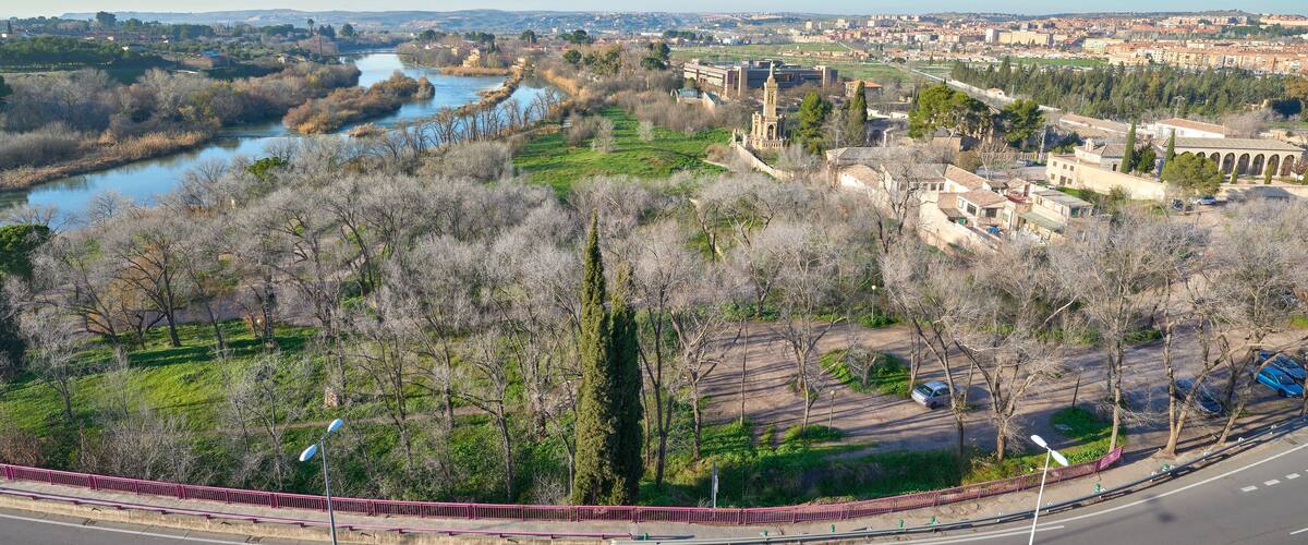 Landscape view of the Vega Baja / low valley of the city of Toledo with the Cristo de la Vega Hermitage and the Tajo / Tagus River and Polvorines bridge on the left, Castilla la Mancha, Spain