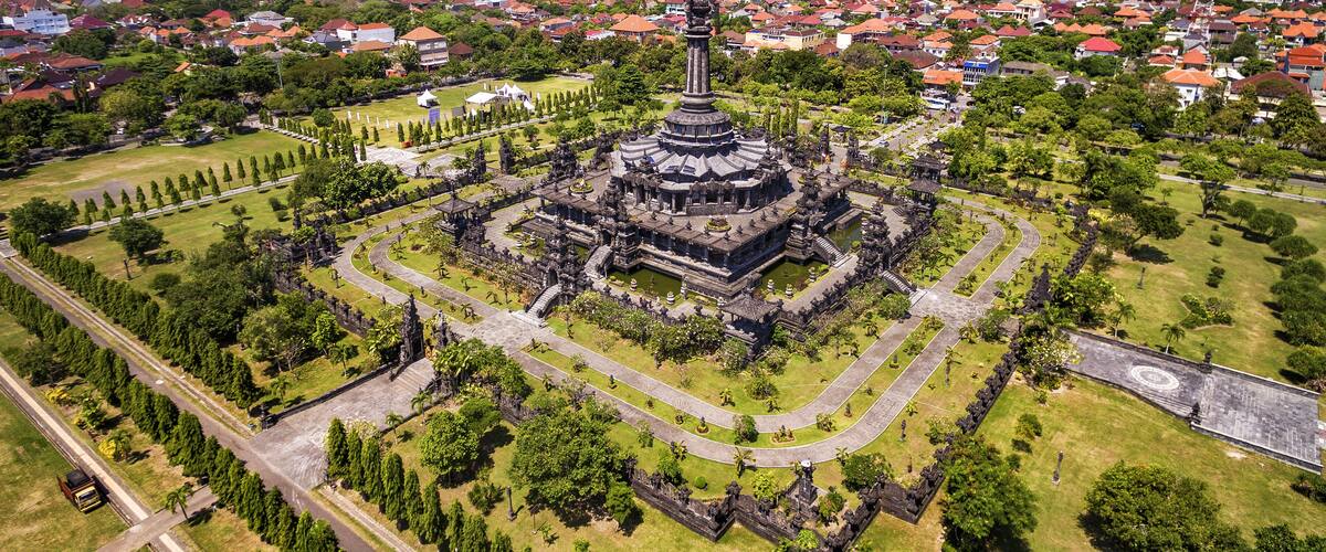 An aerial view of a historic temple complex surrounded by a cityscape.