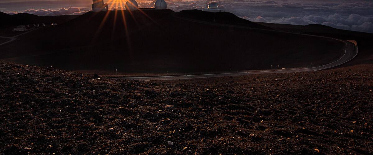 The summit of Mauna Kea during sunset. Because we are so high the sun actually sets into the clouds below.