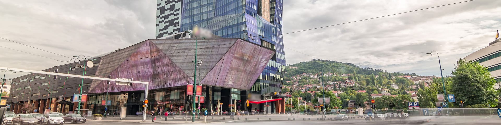 Skyscrapers and shopping mall with large luminous screen in Sarajevo City Center timelapse hyperlapse
