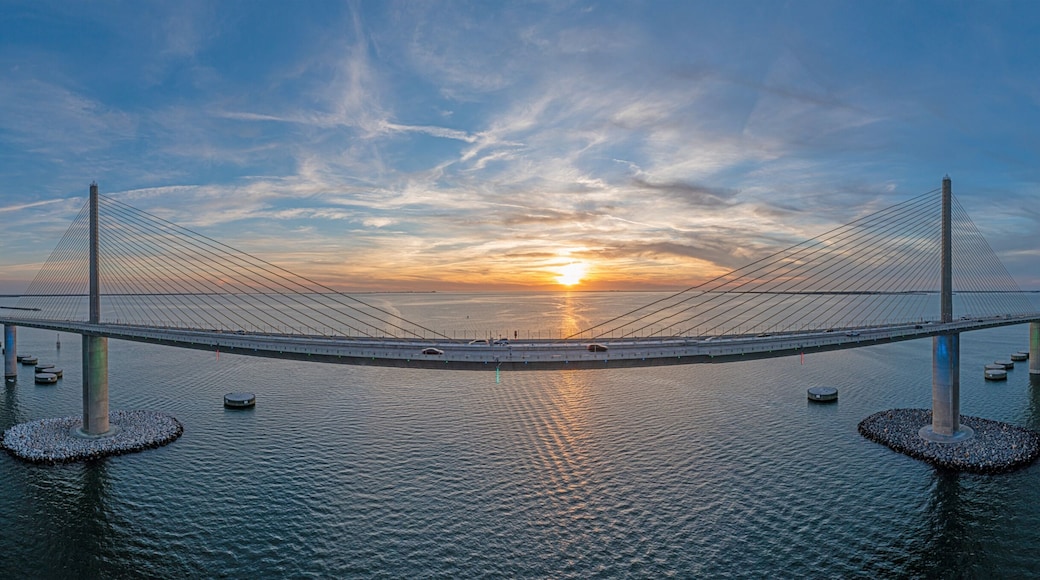 Drone panorama of Sunshine Skyway Bridge over Tampa Bay at sunset