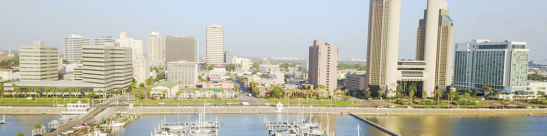 Panorama aerial view Corpus Christi bay front skyline and yacht parking area in morning