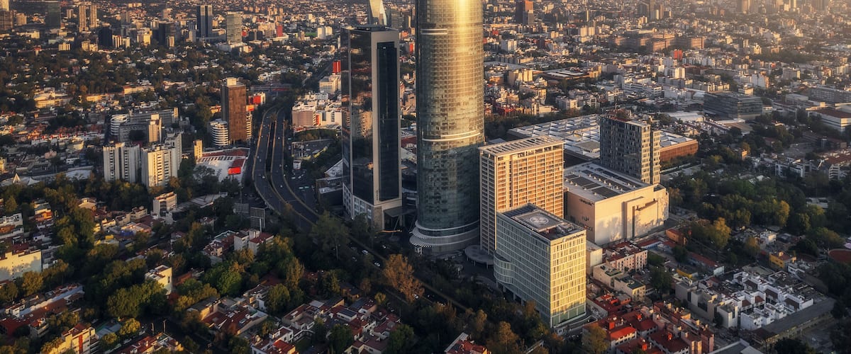 Aerial view of mitikah tower illuminated at night with a stunning cityscape, coyoacan, mexico.