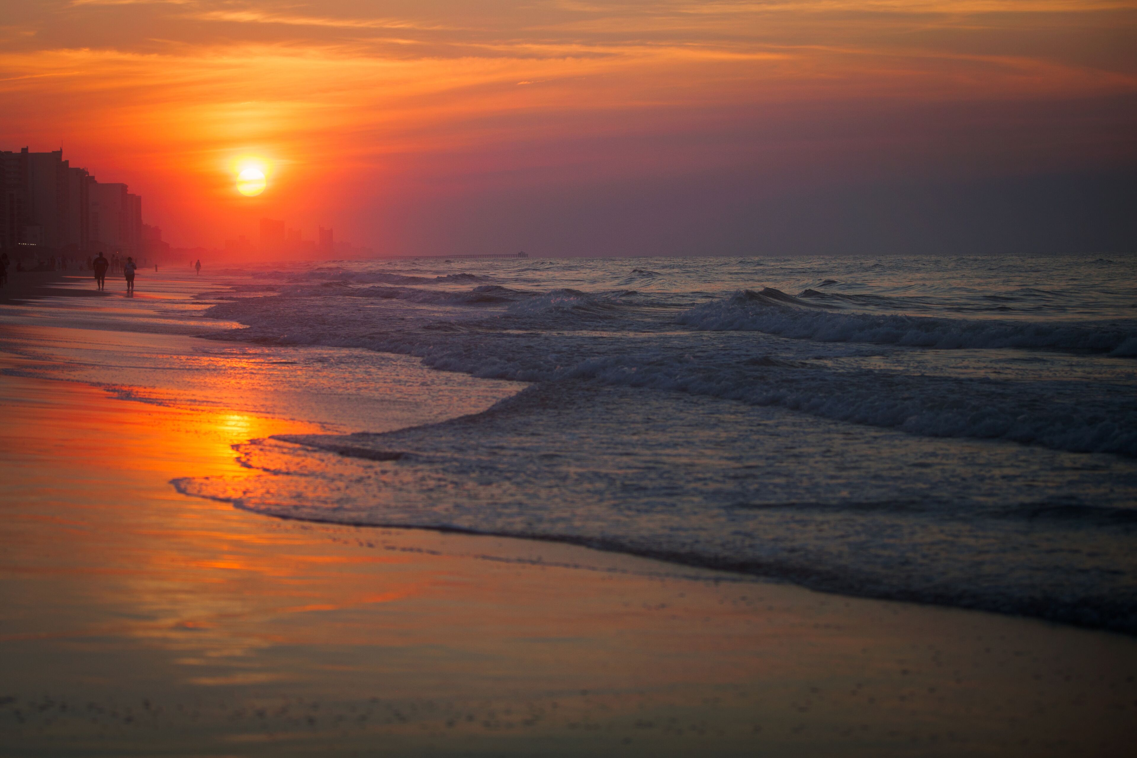 People on beach at sunset, North Myrtle Beach, South Carolina, United States