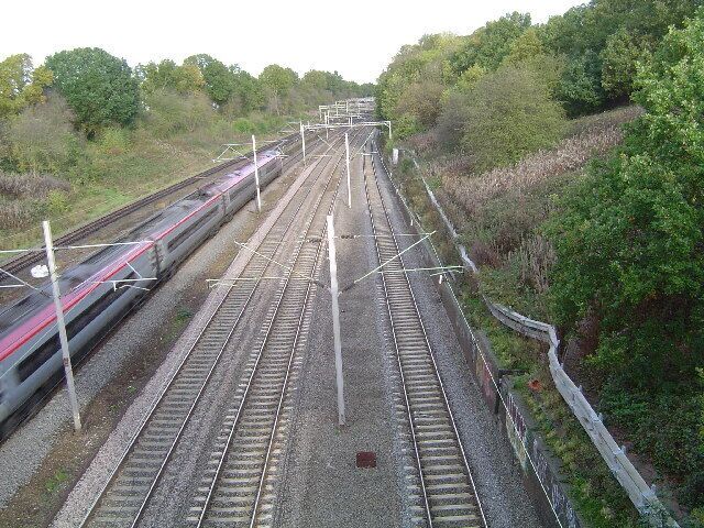 Carpenders Park: West Coast Main Line railway. Viewed looking northwards from the B4542 Little Oxhey Lane overbridge towards Carpenders Park station.