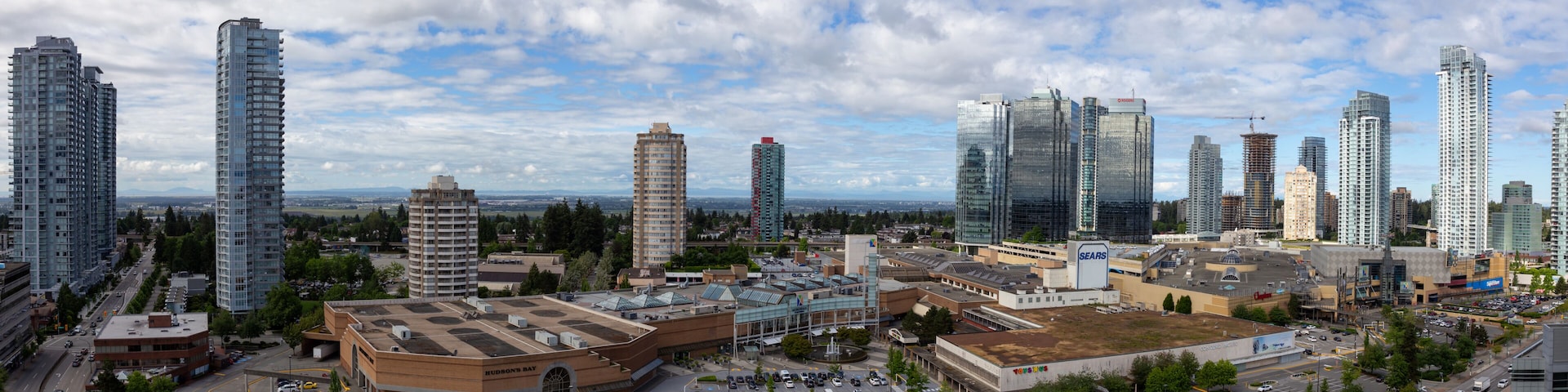 Metrotown, Burnaby, Vancouver, BC, Canada - June 26, 2018: Aerial view of Metropolis Shopping Mall during a vibrant summer day.