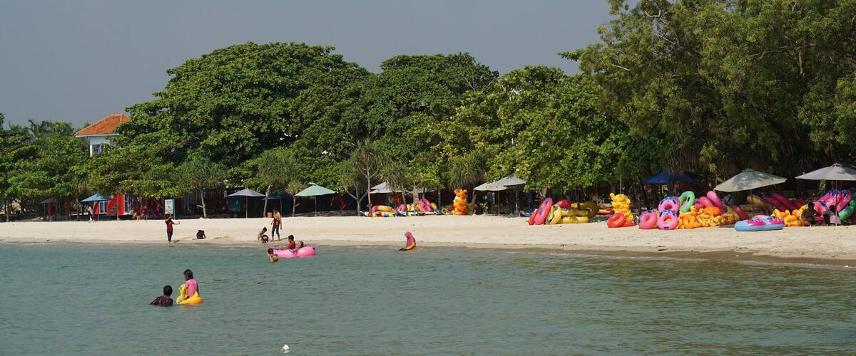Beautiful view of the white sand beach located on Bandengan beach, Beautiful view of the blue sky, ocean and white sand. Jepara, Indonesia- May 28, 2023