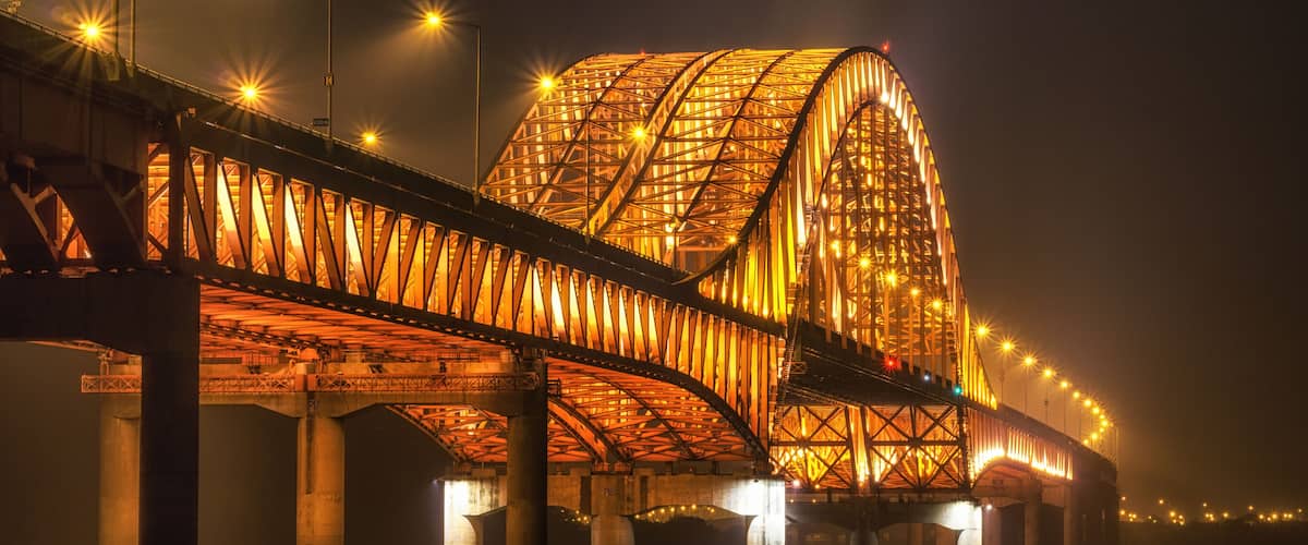 banghwa bridge at night over the han river in seoul, south korea