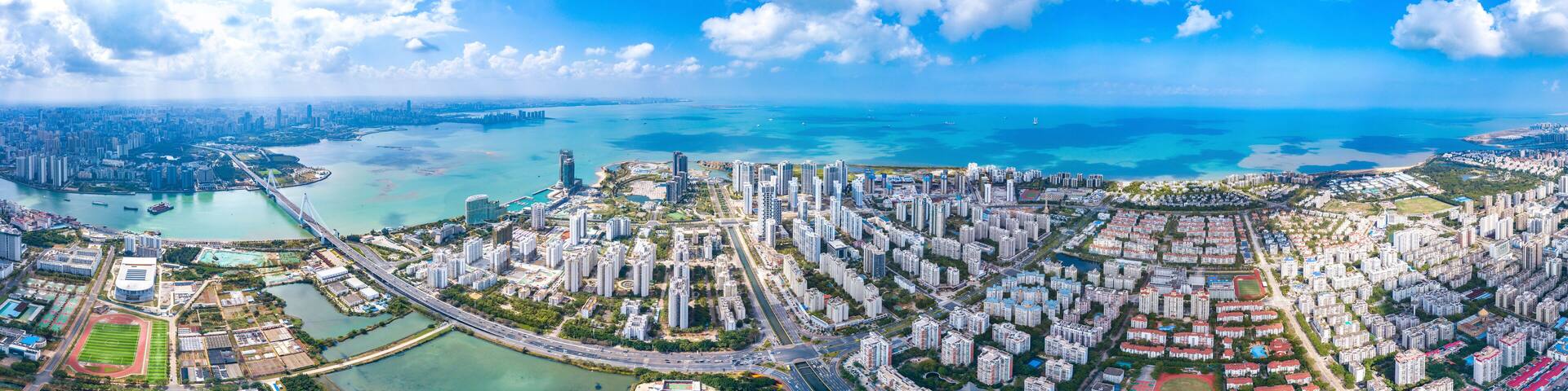 Aerial Cityscape and Bay View of Meilisha District, Haidian Island, Haikou City, Hainan Province, China.
