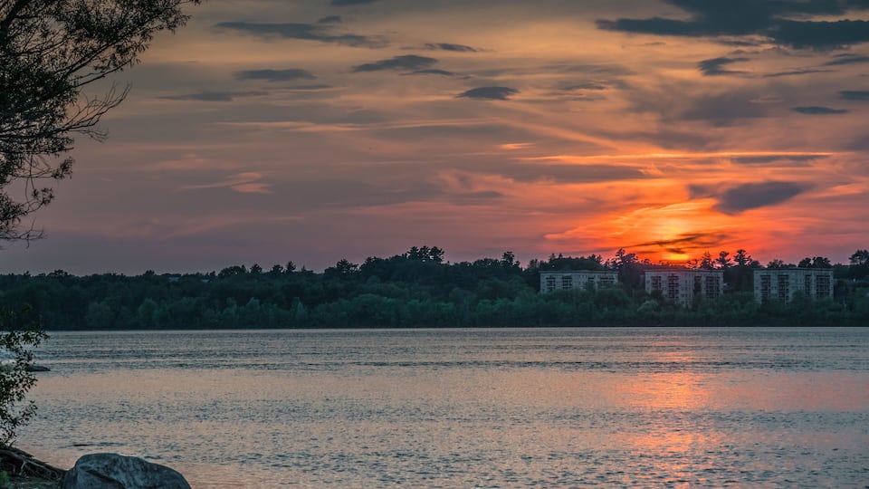 OTTAWA, ONTARIO / CANADA - JULY 30 2017: SUNSET AT OTTAWA RIVER. GATENAU VIEW.