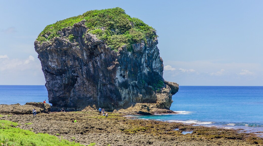 Chuanfan Rock (Sail Rock) and Water Sports by the Beach of Kenting, Pingtung, Taiwan; Shutterstock ID 551759173; purchase_order: SF 06557000; job: ; client: ; other: