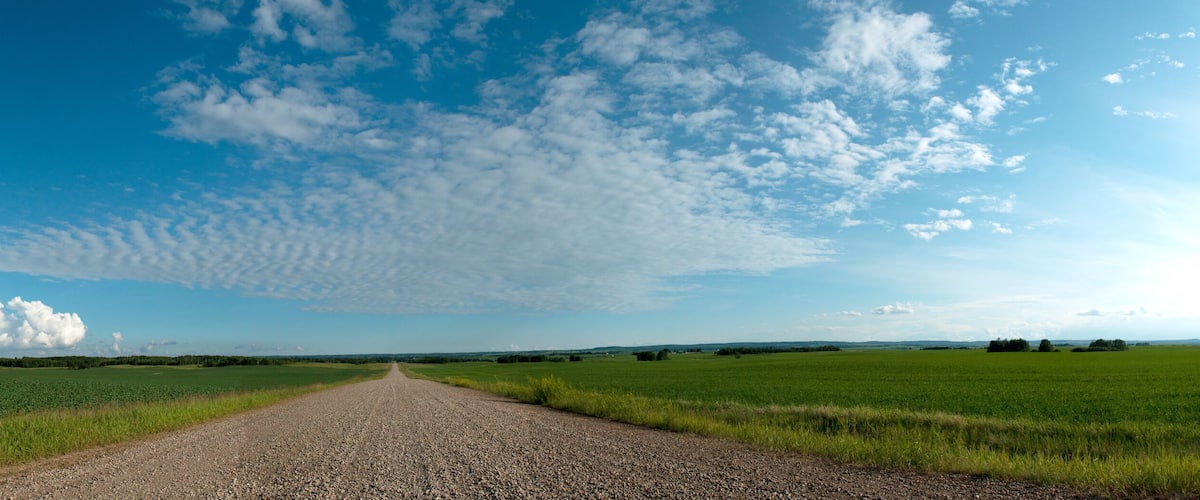 Alberta Road Panorama in the sunshine with beautiful clouds