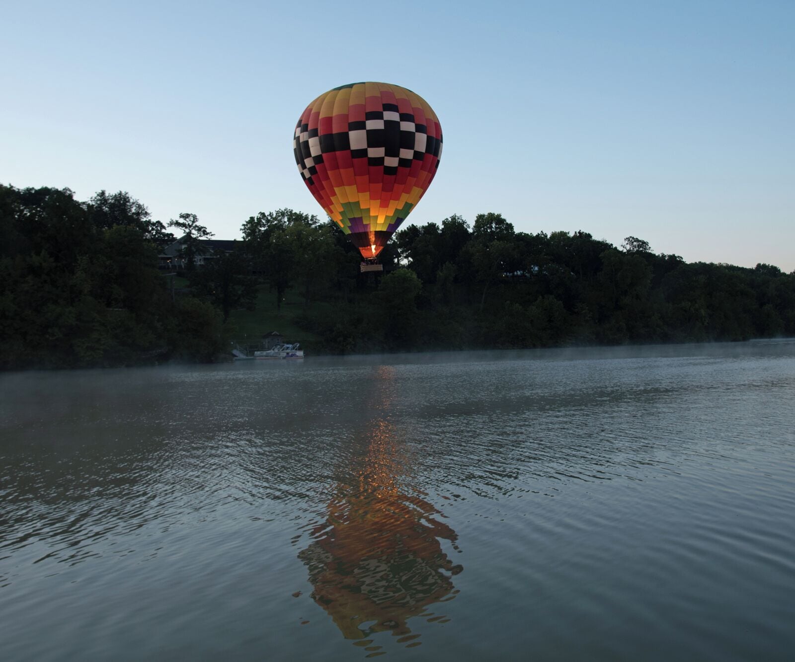Sunrise launch with Eagle Ridge Resort in the background. That hot air balloon is 4 stories high so a wide angle lens is a must. I was using a 14 - 24 2.8 Nikon lens to get these shots. Once the balloon gets too far I quickly switch to a 24 - 120 F4 Nikon lens. If you visit Galena you have to fly in the balloon with Andy Williams from Galena on the Fly. You will not be disappointed. 