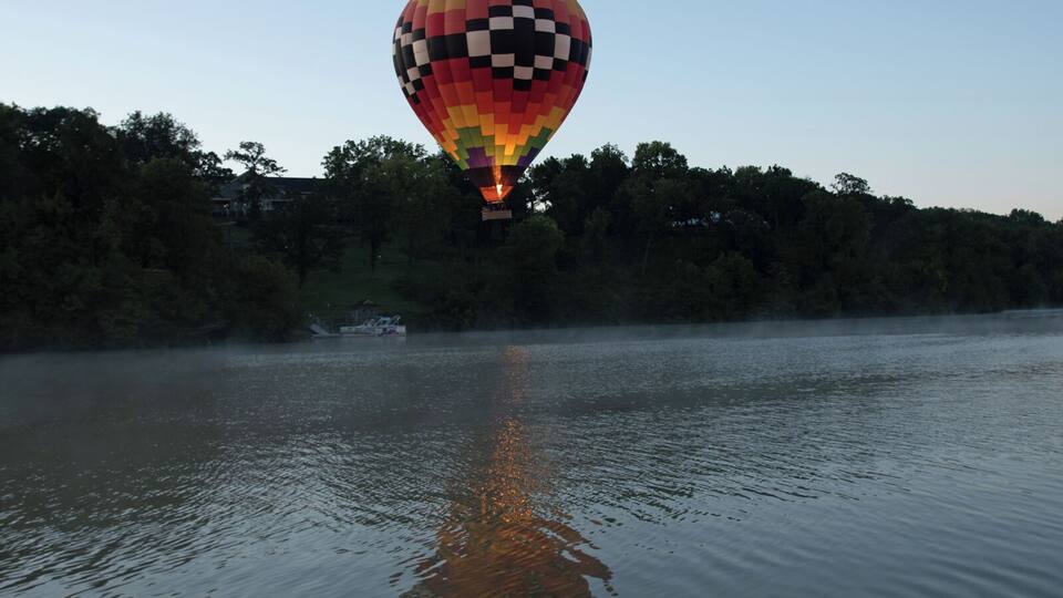 Sunrise launch with Eagle Ridge Resort in the background. That hot air balloon is 4 stories high so a wide angle lens is a must. I was using a 14 - 24 2.8 Nikon lens to get these shots. Once the balloon gets too far I quickly switch to a 24 - 120 F4 Nikon lens. If you visit Galena you have to fly in the balloon with Andy Williams from Galena on the Fly. You will not be disappointed.