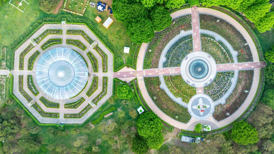 Janghang-dong, Ilsan, Goyang-si, Gyeonggi-do, South Korea - May 4, 2024: Aerial and top angle view of round walking trail with trees on the garden of Ilsan Lake Park