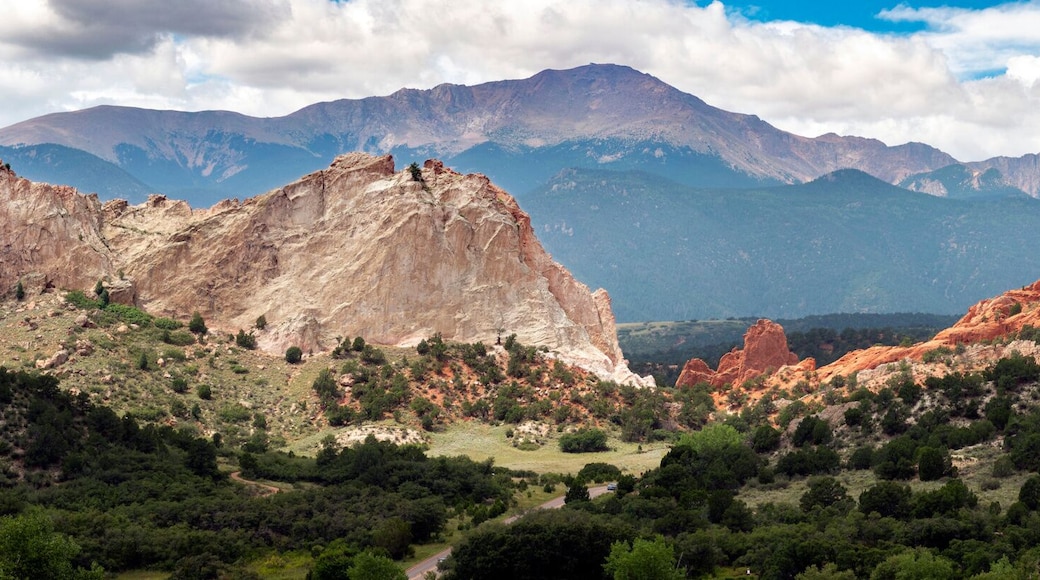 Beautiful panormaic view of Garden of the Gods in Colorado Springs. The Red Rock stone formations rise hundreds of feet above the desert floor. In the distance you can see Pikes Peak.