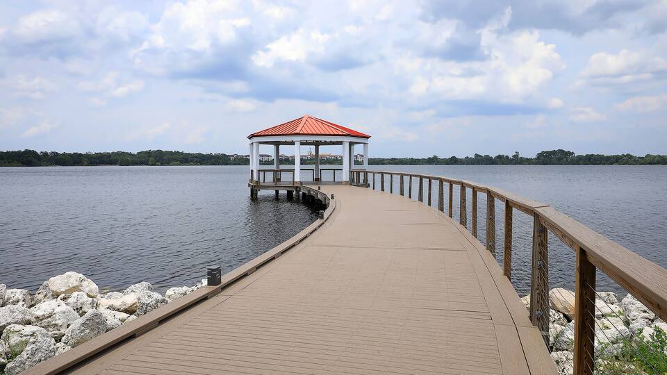 Covered lake view shelter at the end of New Broad Street in Baldwin Park, Orlando, Florida, USA.