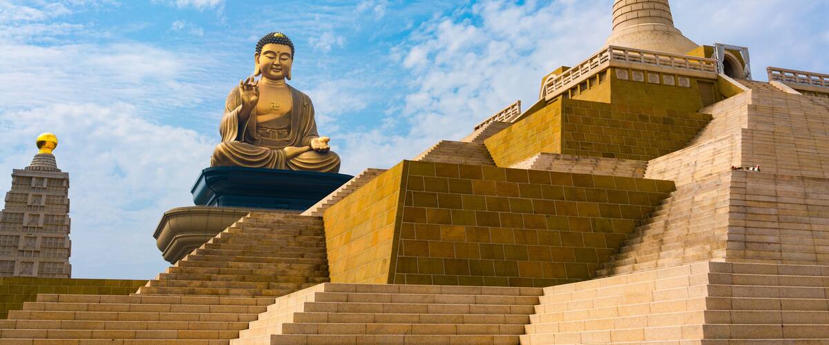 Grand bronze Buddha sitting statue at Fo Guang Shan in Kaohsiung Taiwan