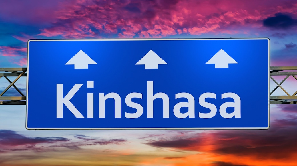 Road sign indicating direction to the city of Kinshasa