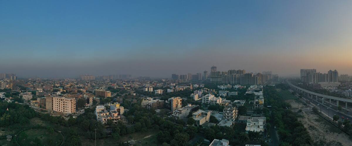 Coronavirus, Covid-19, lock down situation in delhi, india, Panoramic aerial view of Noida,gurgaon, india, Rapid metro tracks in urban areas of Delhi NCR. Cityscape.. sars-cov-2