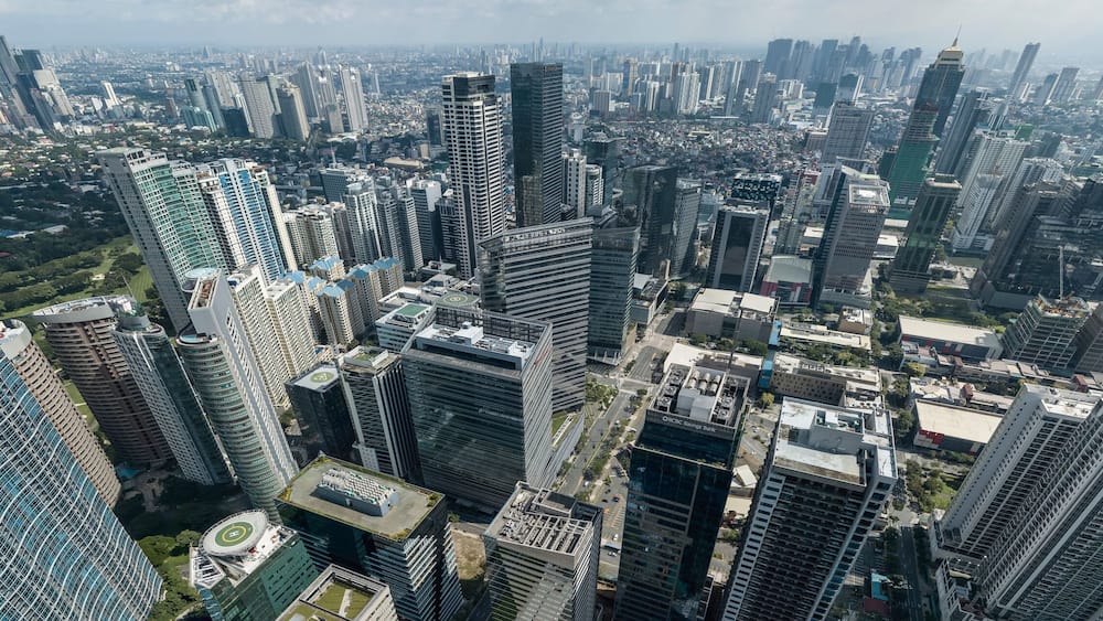 Bonifacio Global City, Taguig, Metro Manila - Panoramic aerial of Fort Bonifacio skyline and Metro Manila urban area. Ortigas skyline at the back.