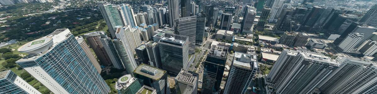 Bonifacio Global City, Taguig, Metro Manila - Panoramic aerial of Fort Bonifacio skyline and Metro Manila urban area. Ortigas skyline at the back.