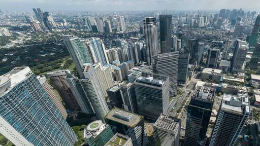 Bonifacio Global City, Taguig, Metro Manila - Panoramic aerial of Fort Bonifacio skyline and Metro Manila urban area. Ortigas skyline at the back.