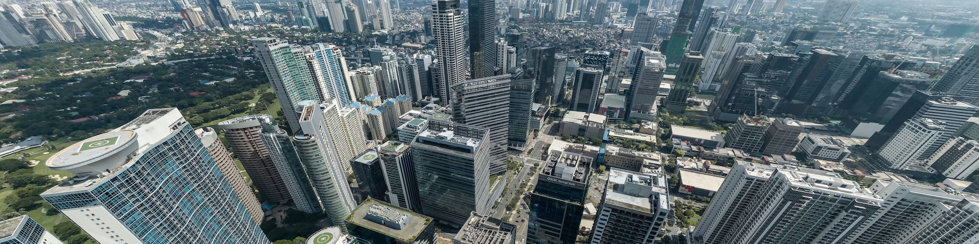 Bonifacio Global City, Taguig, Metro Manila - Panoramic aerial of Fort Bonifacio skyline and Metro Manila urban area. Ortigas skyline at the back.