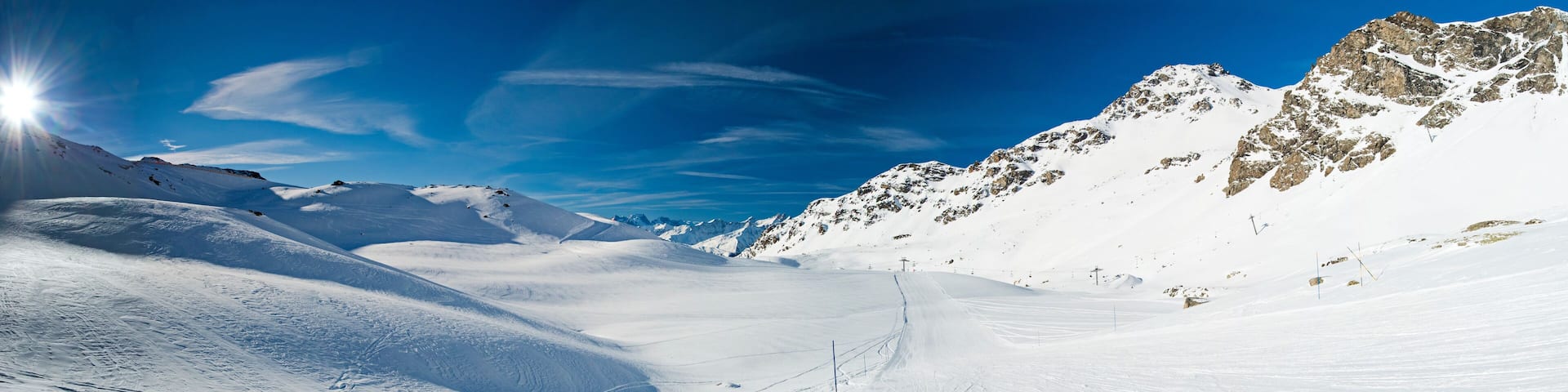 Skiers on a piste in alpine ski resort
